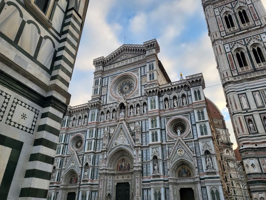Florence: Walking Tour of Dante's Florence with a Guide - Piazza Santa Croce: the Dante statue holding the Divine Comedy